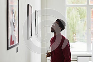 African-American Man Visiting Art Gallery Opening