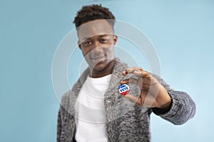 African american Man with Vote button in hand
