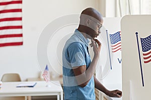 African-American Man in Voting Booth