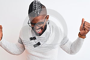 African american man wearing grey sweater and glasses over isolated white background very happy and excited doing winner gesture