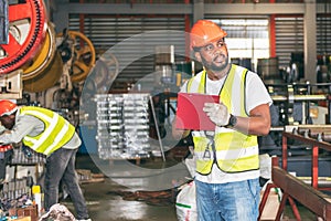 African American man workers, checking and writing material report for used in industrial production,