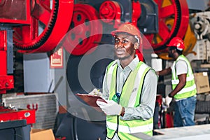 African American man workers, holding a material report for used in industrial production