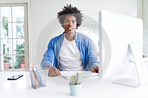 African american man working using computer