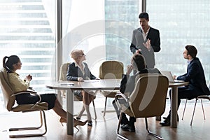 African american manager speaking at diverse board team meeting