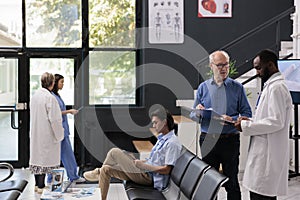 African american medic explaining medical expertise to senior patient during checkup visit appointment