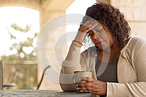 African American middle age woman looking sad.