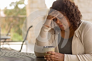 African American middle age woman looking sad.