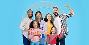African american and middle eastern families on blue, collage