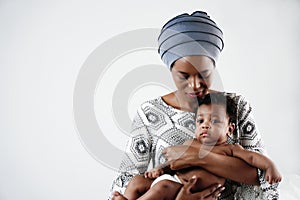 African american mother holding her adorable infant baby son