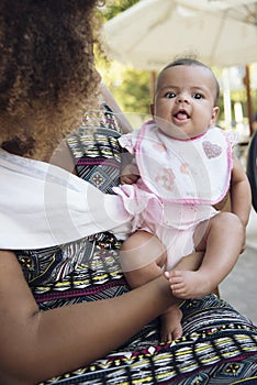 African american mother holds her baby