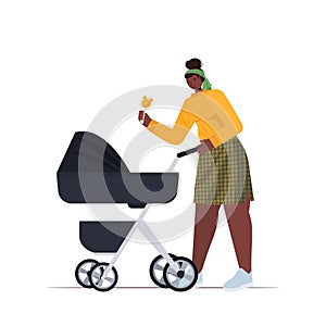 African american mother walking with newborn baby in stroller motherhood concept full length