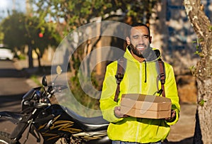 African American motoboy with pizza boxes for delivery