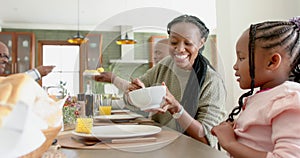 African american parents, children and grandparents celebrating at thanksgiving dinner, slow motion