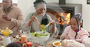 African american parents, children and grandparents celebrating at thanksgiving dinner, slow motion