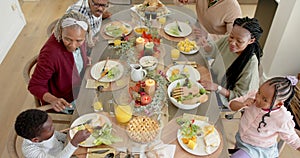 African american parents, children and grandparents celebrating at thanksgiving dinner, slow motion