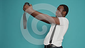 African american person holding dslr camera to take pictures