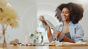 African American Pregnant woman packing her baby clothes