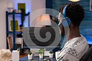 African american programmer with headset programming website code