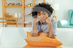 African american sad thoughtful girl at home. Young african woman feels depressed offended lonely upset suffers from