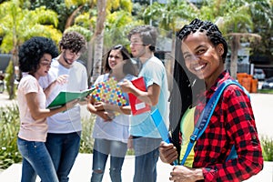 African american scholarship student with group of international