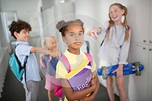 African-American schoolgirl feeling offended at school