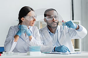 African american scientist in safety goggles