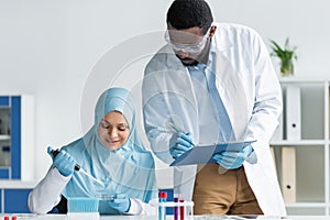 African american scientist in safety goggles