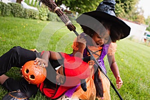 african american siblings in halloween costumes