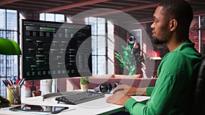 African american software developer does visual coding and creating software