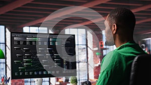 African american software developer does visual coding and creating software