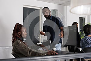 African american software developers discussing about coding script