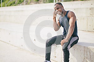 African American sportsman or jogger. black man listening to music