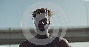 African American sportsman looking at camera