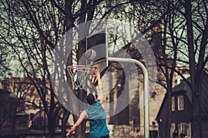 African-american streetball player practicing outdoors