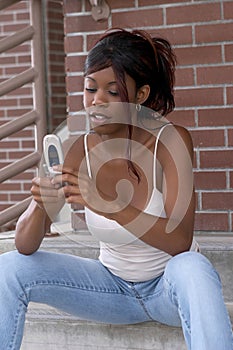 African American Student Dialing Cell Phone