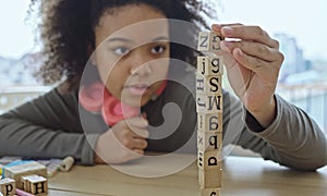 African American student doing activity playing block wooden for development together with enjoy and fun in the classroom