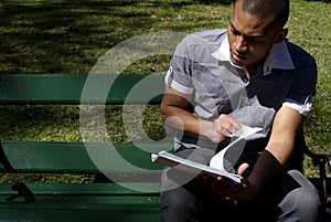 African American Student Reading Outdoors