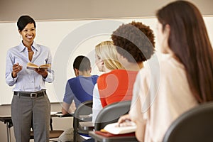 African American teacher teaching at front of class photo