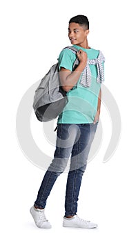 African-American teenage boy with backpack on white