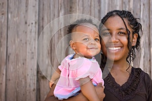 African American teenage mother and her daughter.