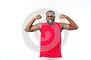 African American teenager shows muscles on arm. Isolated on white background. Studio portrait. Transitional age concept