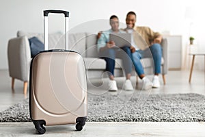 African American Tourists Couple Using Laptop Indoor, Focus On Luggage