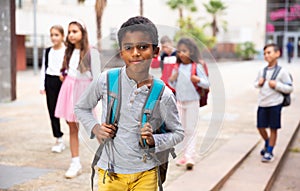 African american tweenager going to school on autumn day