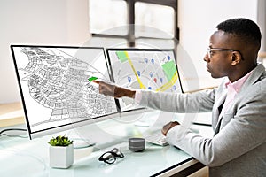 African American Using Cadastral Map photo