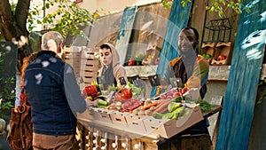 African american vendor working at farmers market counter