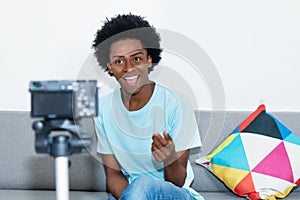 African american vlogger recording video blog photo