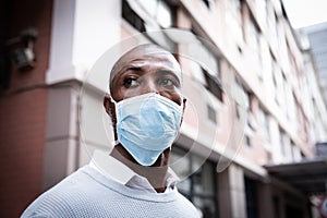 African American wearing covid19 coronavirus mask in the street