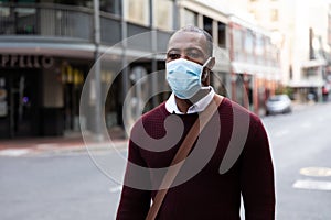 African American wearing covid19 coronavirus mask in the street