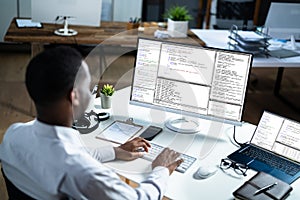 African American Web Coder At Computer. Software Programmer