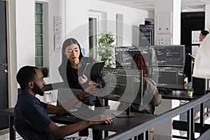 African american web developer using computer to write code and develop algorithm program